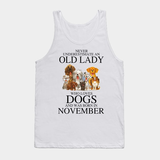 Never Underestimate An Old Lady Who Loves Dogs And Was Born In November Tank Top by louismcfarland